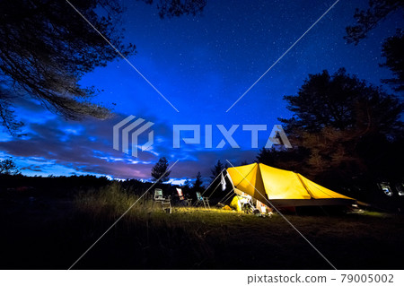Family tent on camping ground under stars Family tent on camping ground under stars 79005002
