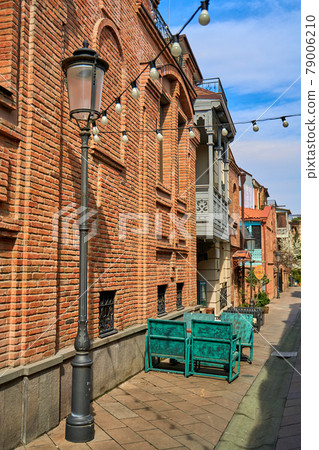 Summer terrace and restaurant table on the street in a cozy old district of Tbilisi Summer terrace and restaurant table on the street in a cozy old district of Tbilisi 79006210