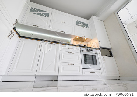Luxurious white modern kitchen interior Luxurious white modern kitchen interior 79006581