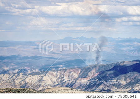 smoke plume from controlled forest burn 79006641