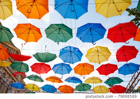 multicolor umbrellas in the sky 79008589