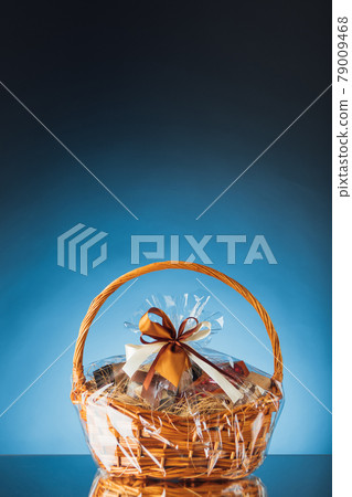 gift basket on blue background gift basket on blue background 79009468