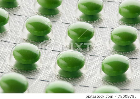 blister pack with green pills 79009783