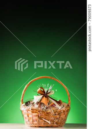 gift basket on green background 79009873
