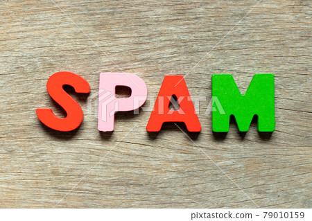Color alphabet letter in word spam on wood background 79010159