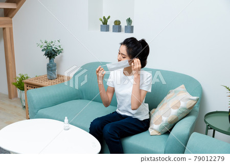 Sick girl wearing a mask Sick girl wearing a mask 79012279