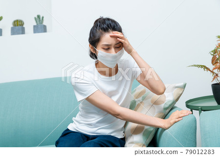 Sick girl wearing a mask Sick girl wearing a mask 79012283