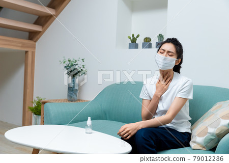 Sick girl wearing a mask Sick girl wearing a mask 79012286