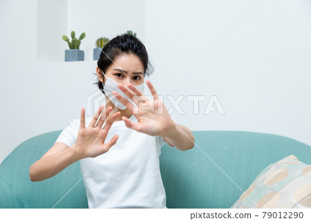 Sick girl wearing a mask 79012290