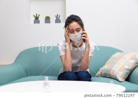 Sick girl wearing a mask Sick girl wearing a mask 79012297
