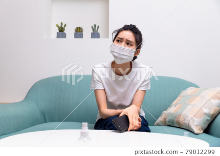 Sick girl wearing a mask Sick girl wearing a mask 79012299
