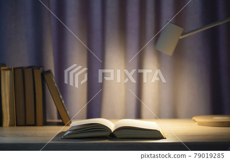 Book background. Open book on a table in a university or home desk and school library. Reading, literature, study and knowledge concept. Book background. Open book on a table in a university or home desk and school library. Reading, literature, study and knowledge concept. 79019285