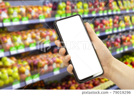 Online grocery delivery app in a mobile phone. Food market service in smartphone. Grocery delivery background concept. Shopping cart. Empty blank screen  79019296