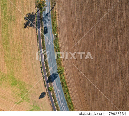 Drone shot of a grey country roaud from nadir perspective Drone shot of a grey country roaud from nadir perspective 79022584