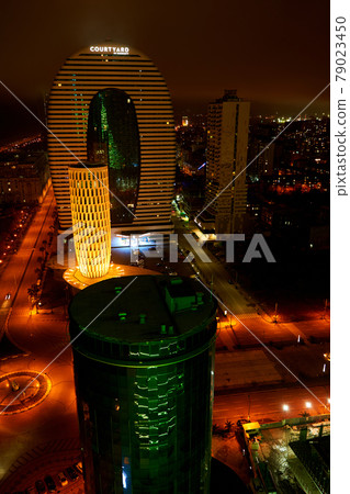 Night cityscape of Batumi. Modern architecture in the city lights Night cityscape of Batumi. Modern architecture in the city lights 79023450