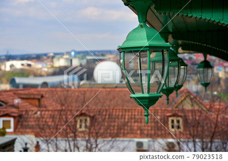 Details of the architecture of the old city. Old street lamps on the veranda Details of the architecture of the old city. Old street lamps on the veranda 79023518