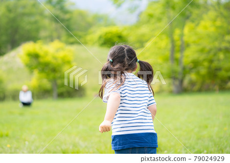 A girl running in green A girl running in green 79024929