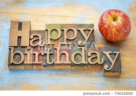 Happy Birthday in wood type with apple Happy Birthday in wood type with apple 79026800