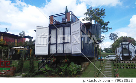 SERDANG, MALAYSIA -DECEMBER 03, 2016: A house designed from refurbish shipping container at Serdang, Malaysia. SERDANG, MALAYSIA -DECEMBER 03, 2016: A house designed from refurbish shipping container at Serdang, Malaysia. 79028838