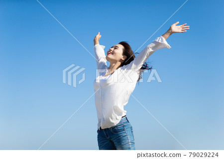 asian Woman Cheering Open Arms 79029224