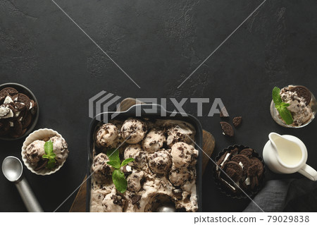 Homemade creamy and cookies ice cream in container. Tasty clean eating dessert, sugar free. Homemade creamy and cookies ice cream in container. Tasty clean eating dessert, sugar free. 79029838