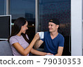 Happy couple husband and wife drink tea late at night. 79030353