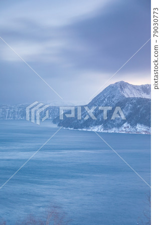 Lake Mashu covered in clouds 79030773