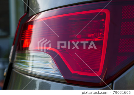 Car tail lights and rear brake lights close 79031605