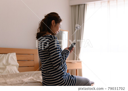 Female portrait in home bedroom Female portrait in home bedroom 79031702