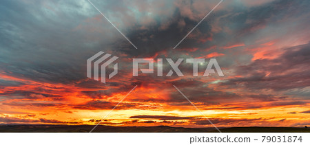 Deep red cloudy sunset with mountain range Deep red cloudy sunset with mountain range 79031874