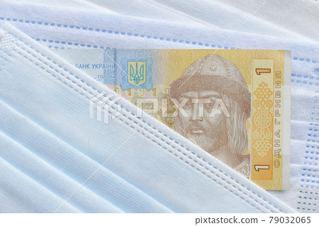 Ukrainian banknote hryvnya on mask 79032065