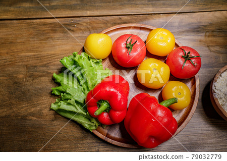 yellow and red tomatoes, lettuce and bell pepper with water drops. food blogger 79032779