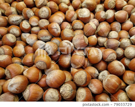 unpeeled hazelnuts. background and texture. agriculture. supermarket unpeeled hazelnuts. background and texture. agriculture. supermarket 79033729