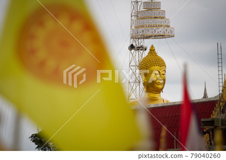 Buddha statue on yellow background 79040260