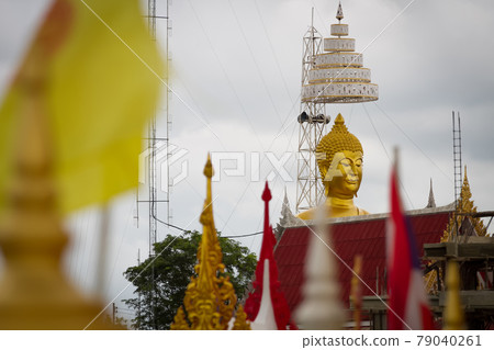 Buddha statue on yellow background Buddha statue on yellow background 79040261