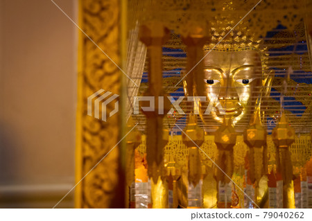Buddha statue on yellow background 79040262