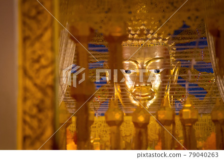 Buddha statue on yellow background Buddha statue on yellow background 79040263