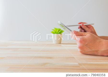 Person who operates the tablet White background Horizontal angle material Person who operates the tablet White background Horizontal angle material 79040358