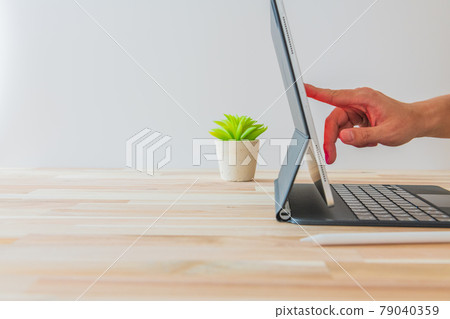 Person who operates the tablet White background Horizontal angle material Person who operates the tablet White background Horizontal angle material 79040359