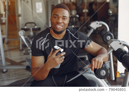 A handsome black man is engaged in a gym 79040801