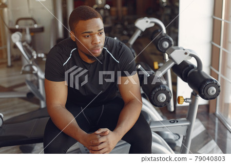 A handsome black man is engaged in a gym 79040803