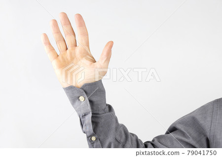 Raised open palm of a man 79041750