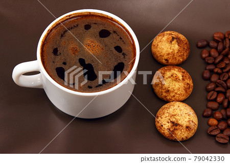 white cup of hot black coffee with biscuits and beans white cup of hot black coffee with biscuits and beans 79042330
