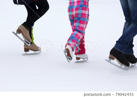 children skate on the ice rink 79042435