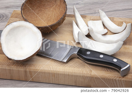 peeled coconut on a wooden board. vitamin fruits. healthy food 79042926