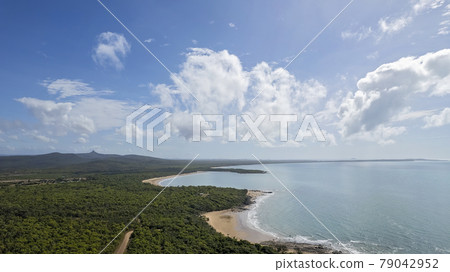 Aerial Over Coastal Shoreline With Calm Ocean 79042952