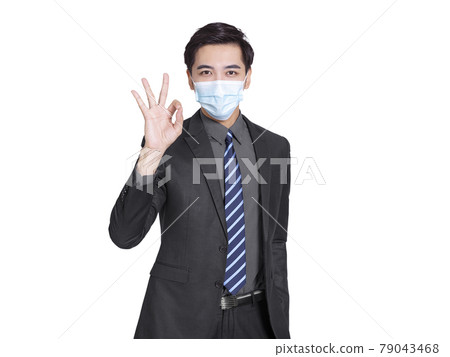 young businessman wearing medical mask OK gesture young businessman wearing medical mask OK gesture 79043468