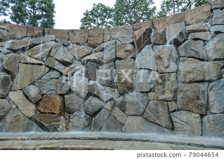 Stone wall and waterfall Stone wall and waterfall 79044654
