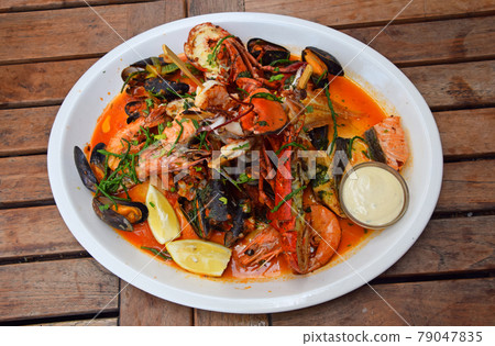 Grilled seafood platter on wooden table Grilled seafood platter on wooden table 79047835