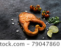 Salmon fillet on an old wooden table 79047860